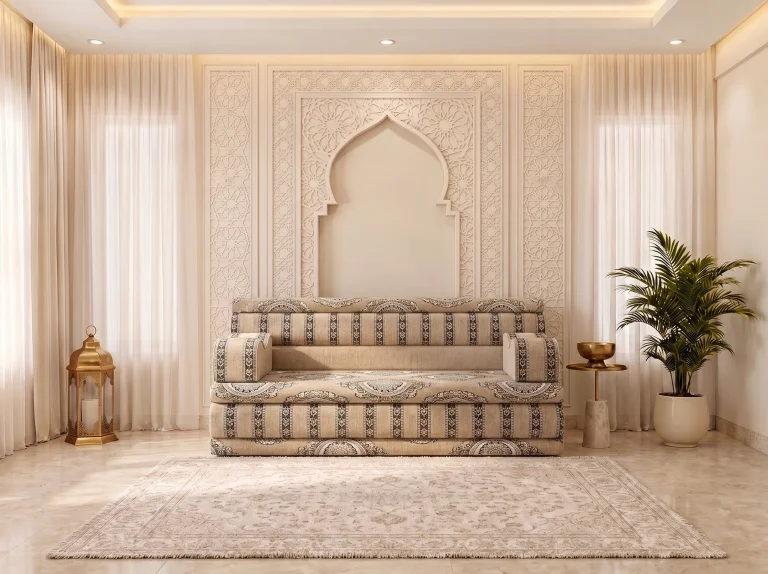 Single beige Arabic jalsa with medallion seat and charcoal-striped backrest centred beneath an arch niche