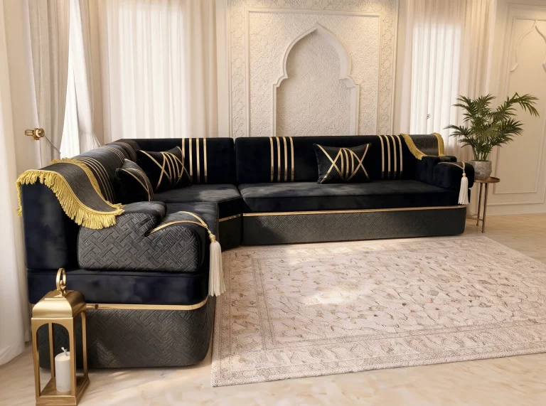 Black velvet Arabic majlis in an L shape viewed from its left armrest, with gold fringe and a brass lantern