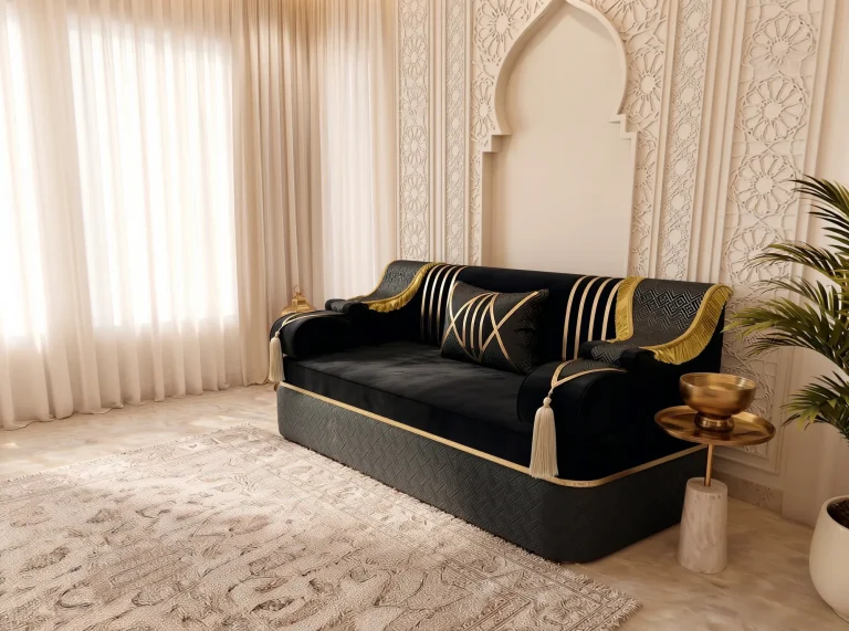 Three-quarter view of a single black and gold Arabic majlis seat with cream tassels beside a brass bowl table