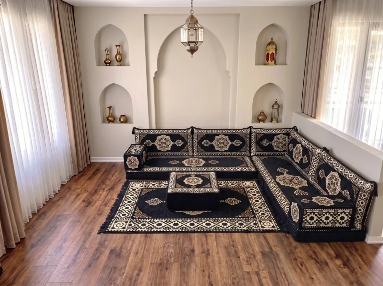 Black and gold medallion floor seating set in an L shape with a matching ottoman on a patterned rug