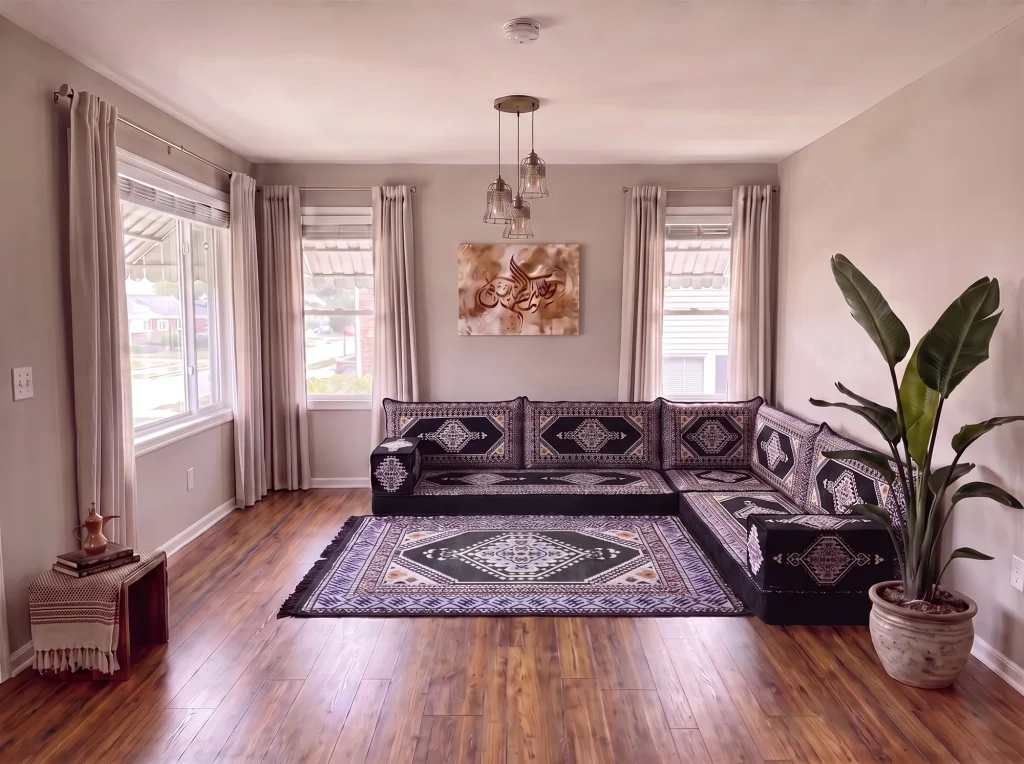 A diamond-pattern rug repeating the black kilim fabric of the seats