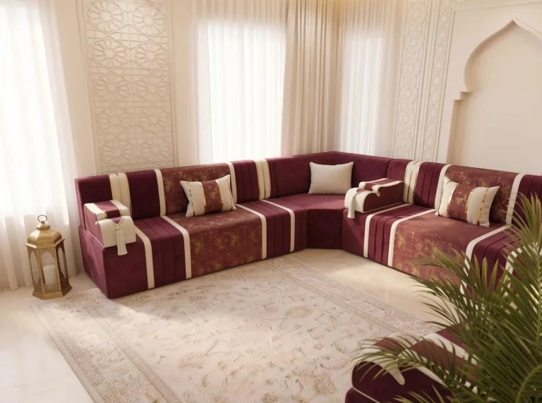 Burgundy and cream striped majlis sofa set filling a corner beside a carved lattice panel and lantern