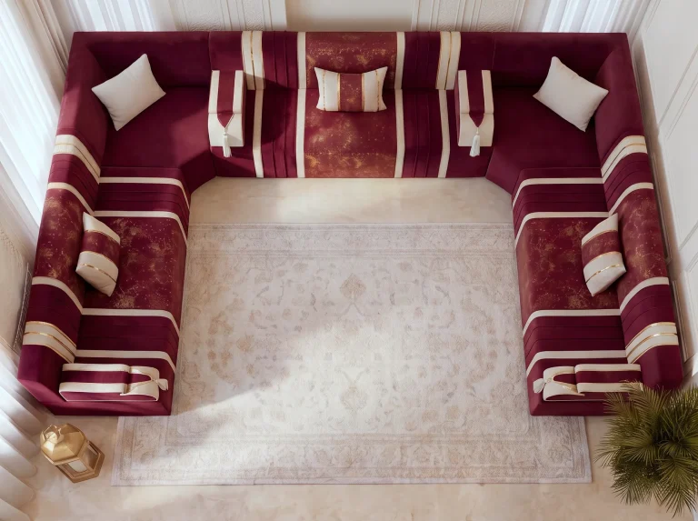 Top-down plan view of a burgundy and cream U-shaped majlis seating set framing a cream medallion rug