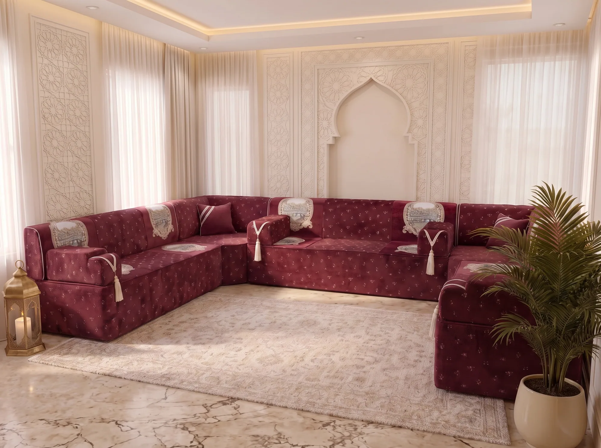 Burgundy velvet majlis sofa set in a U shape viewed from one side behind a potted palm
