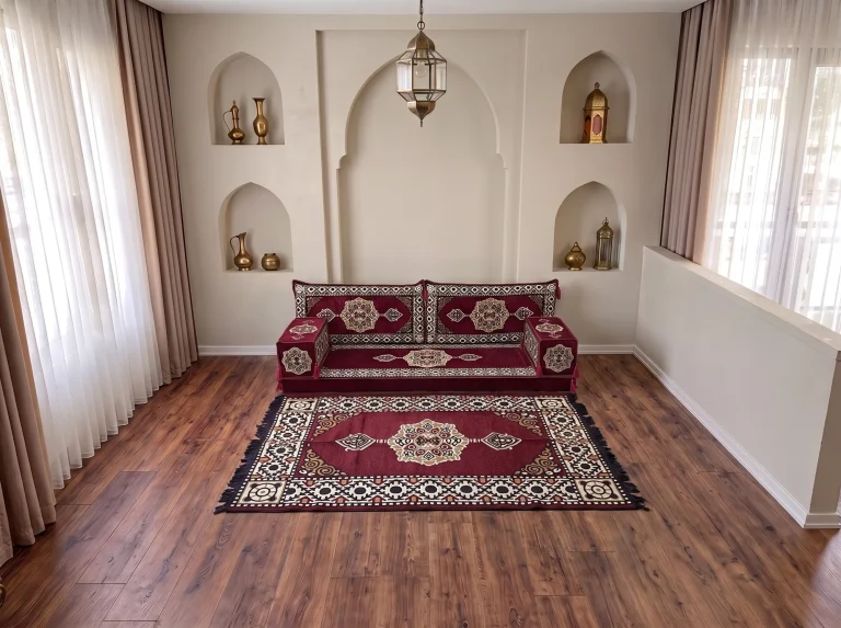 Burgundy medallion single-row floor seating set with a matching fringed rug in a niche-walled reception room