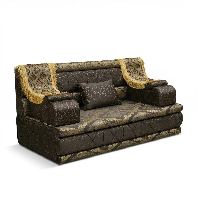 Dark brown and gold brocade Arabic majlis with gold-fringed armrest throws and a crackle-pattern cushion