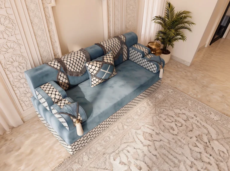 High-angle view of a single dusty blue Arabic jalsa with bold trellis-pattern armrests and base