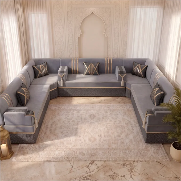 U-shaped grey velvet Arabic jalsa with gold stripes and five dark cushions around a cream rug, seen from above