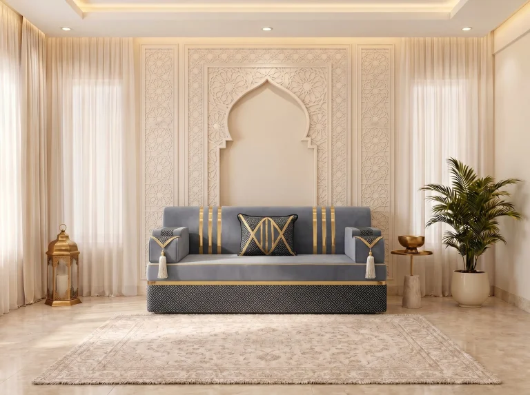 Single grey velvet majlis sofa seat with gold stripes and a black and gold cushion under a carved arch wall