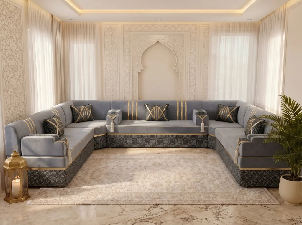 U-shaped grey and gold majlis seating set with a black patterned base lining three walls of a cream room