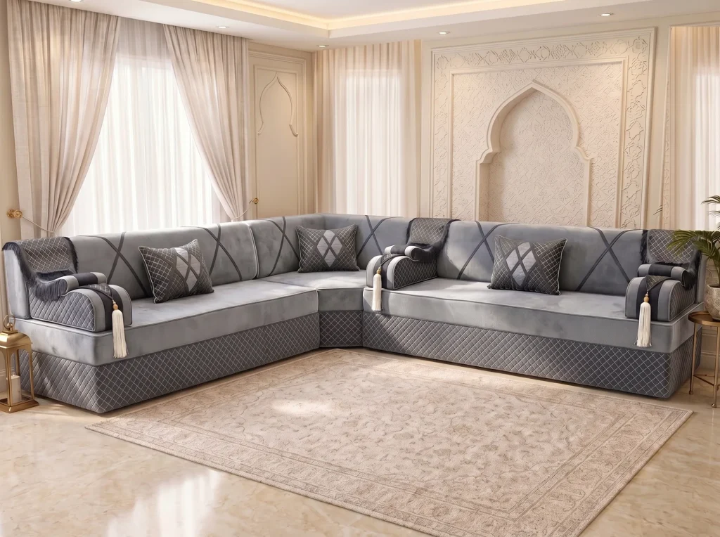 L-shaped grey velvet majlis sofa with a diamond-quilted base and three quilted cushions