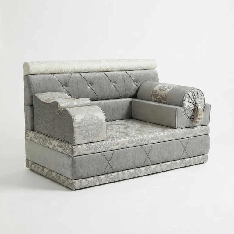 Compact grey chenille majlis sofa with silver damask seat and base band, button-tufted back and a tasselled bolster