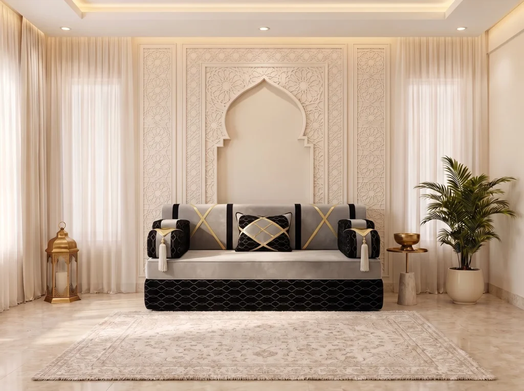 Single light grey majlis sofa seat with black armrests, gold crossed straps and a black lattice-pattern base
