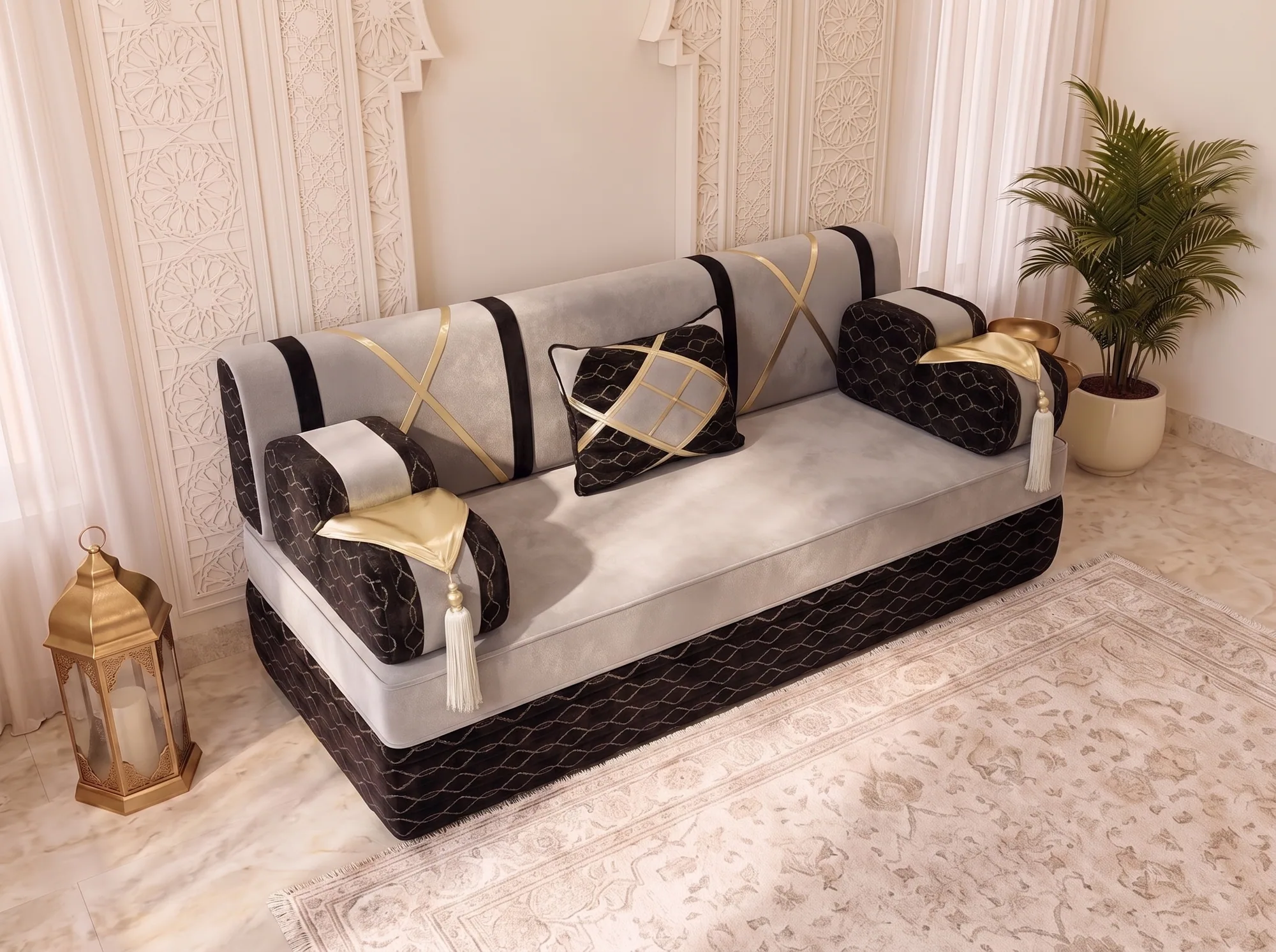 High-angle view of a single light grey majlis sofa seat with black armrests, gold flaps and white tassels