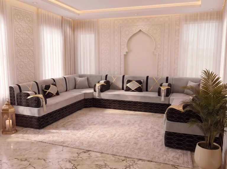 Three-quarter view of a light grey and black Arabic majlis along three walls, with a large palm at the right