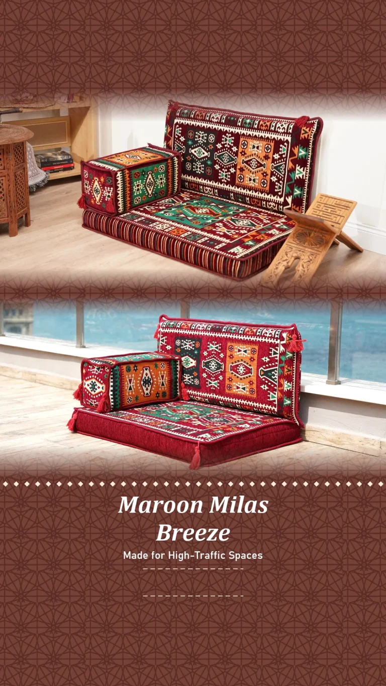 One-seat maroon, green and orange kilim Arabic floor sofa unit beside a carved wooden book stand and by the sea