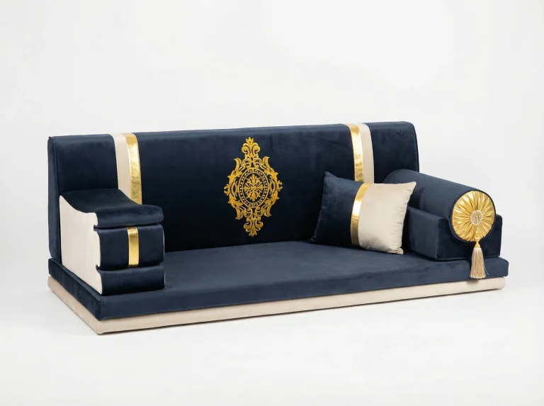 Midnight navy velvet Arabic majlis with a gold embroidered medallion, gold bands and a gold rosette bolster
