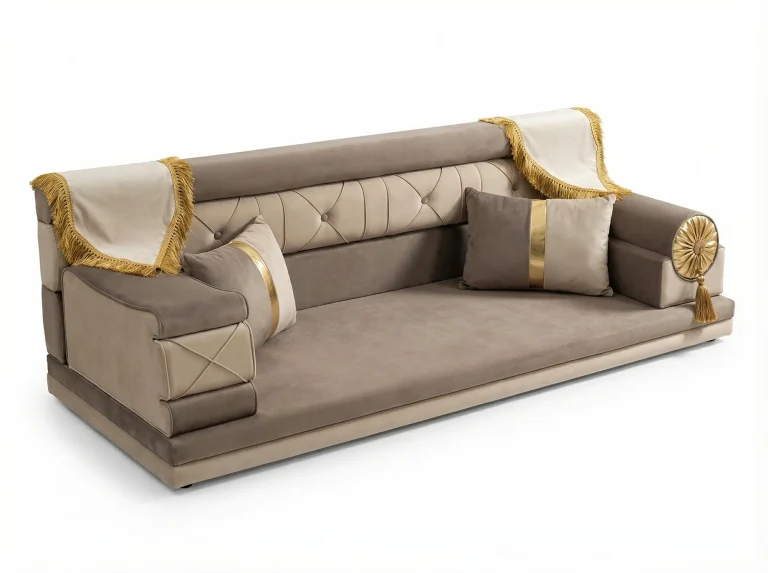 Mocha and beige velvet majlis seating piece with a tufted back, gold-fringed cream throws and a gold rosette bolster