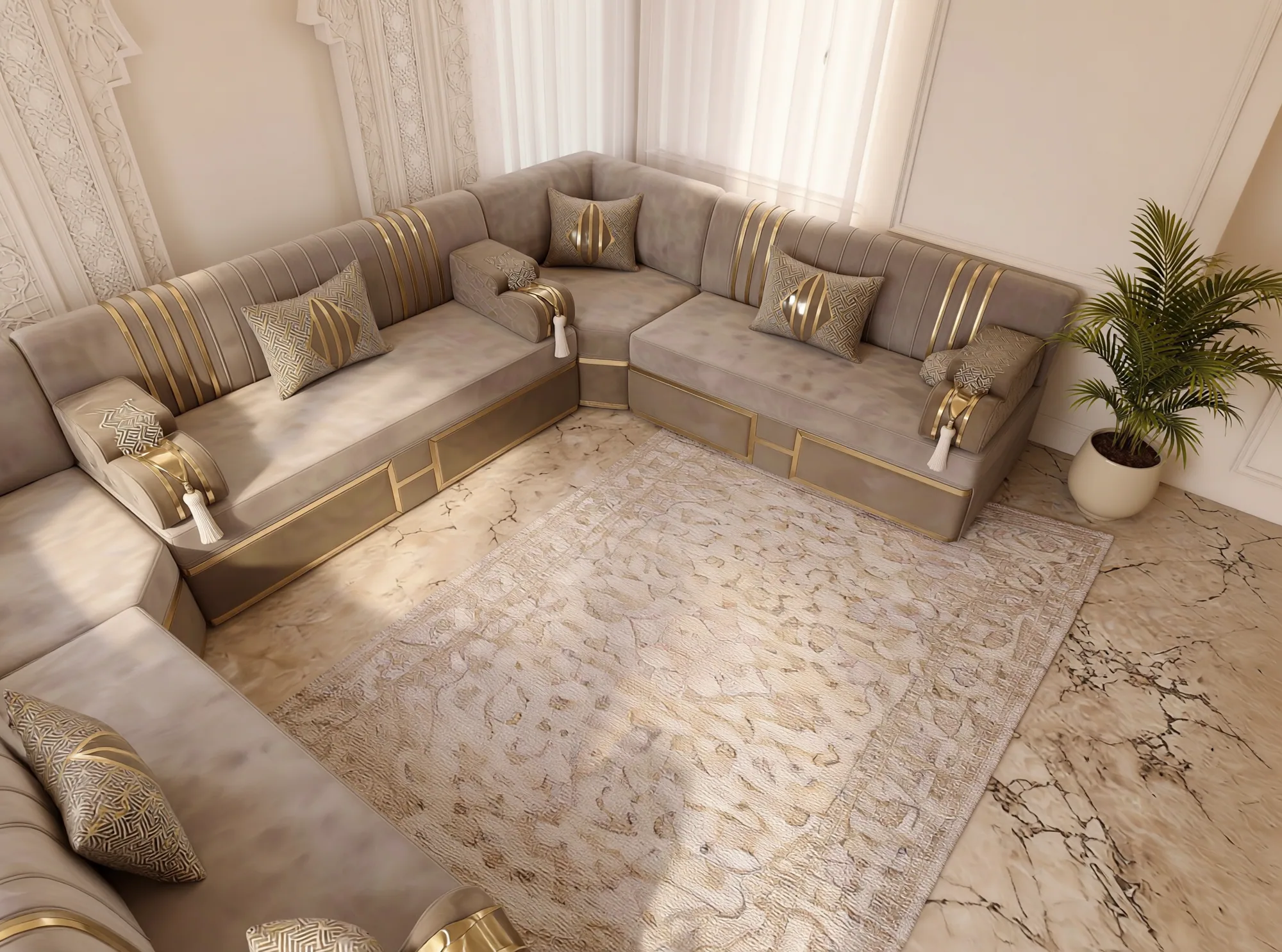 Overhead corner view of a beige velvet Arabic majlis with gold-striped backs wrapping a beige rug on a marble floor
