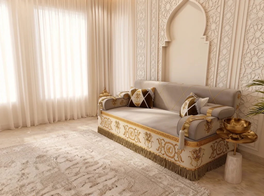 Single beige majlis sofa set module with gold baroque embroidery and fringe, viewed at an angle beside a brass bowl table