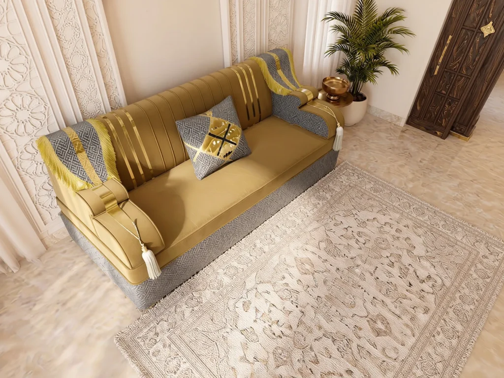 Overhead angled view of a single mustard velvet majlis sofa set module with gold stripes and grey fringed armrest drapes