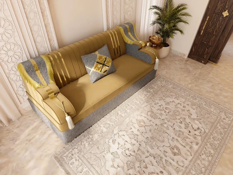 Overhead angled view of a single mustard velvet majlis sofa set module with gold stripes and grey fringed armrest drapes