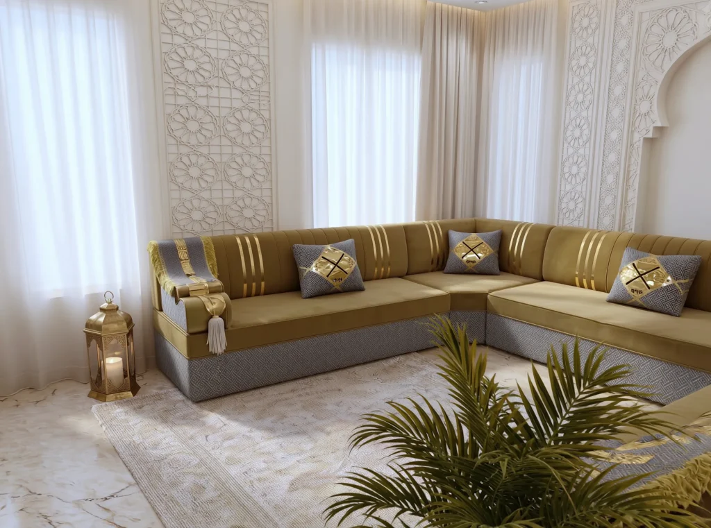 Mustard velvet Arabic majlis with gold stripes and a grey key-pattern base, seen across the corner past a palm