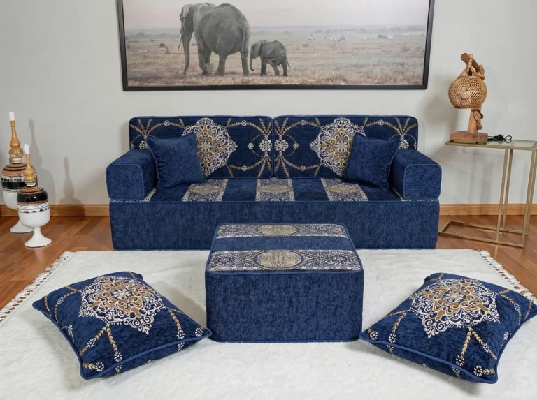 Navy medallion Arabic sofa on a medium-height raised base with a taller ottoman and floor cushions