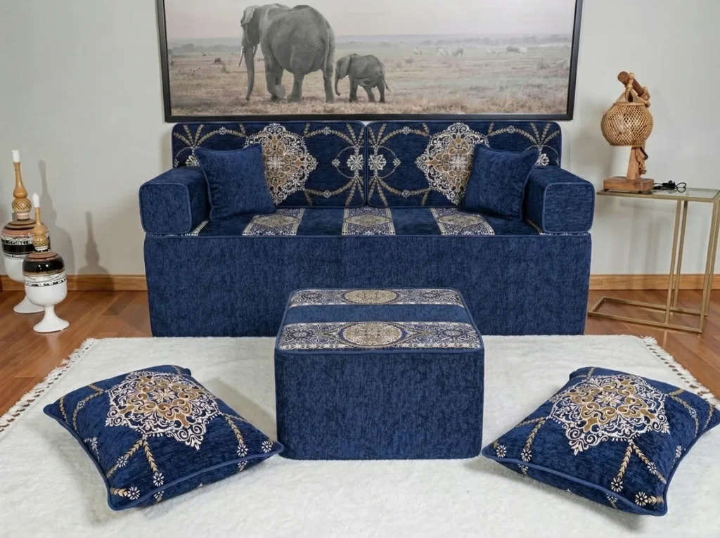 Navy medallion diwan floor sofa raised to regular couch height on a tall base, with a tall cube ottoman