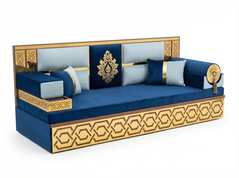 Raised navy and ice blue velvet majlis sofa with a gold hexagon lattice base, gold-framed back and rosette bolster