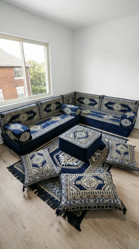 Navy and cream medallion Arabic floor sofa in an L shape under a window