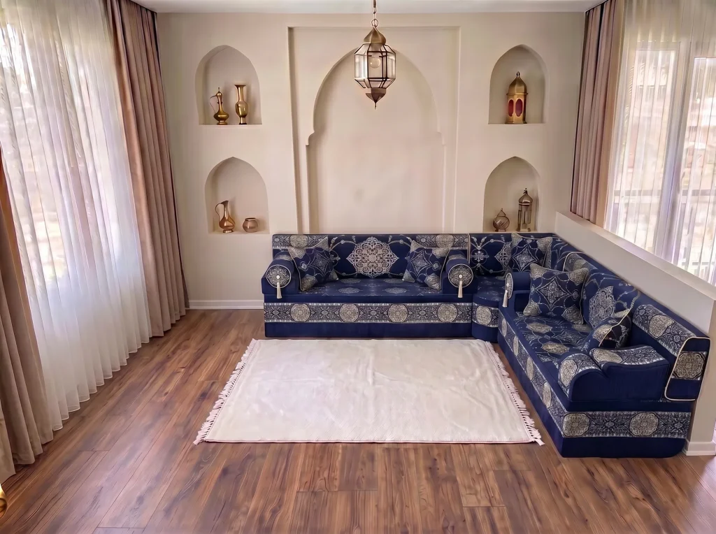 Navy and silver medallion majlis sofa in an L-shaped corner layout beside a plain white fringed rug