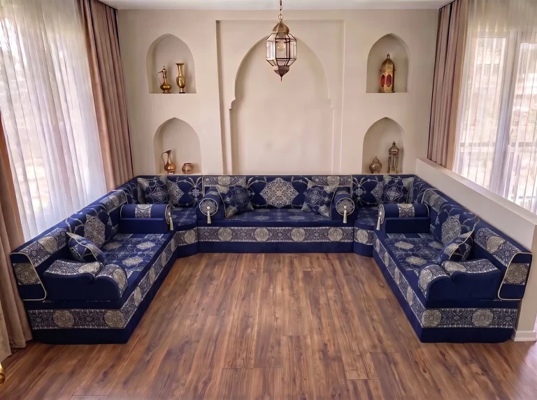 Navy majlis seating with silver medallion fabric in a U shape, shown without rug on a bare wooden floor