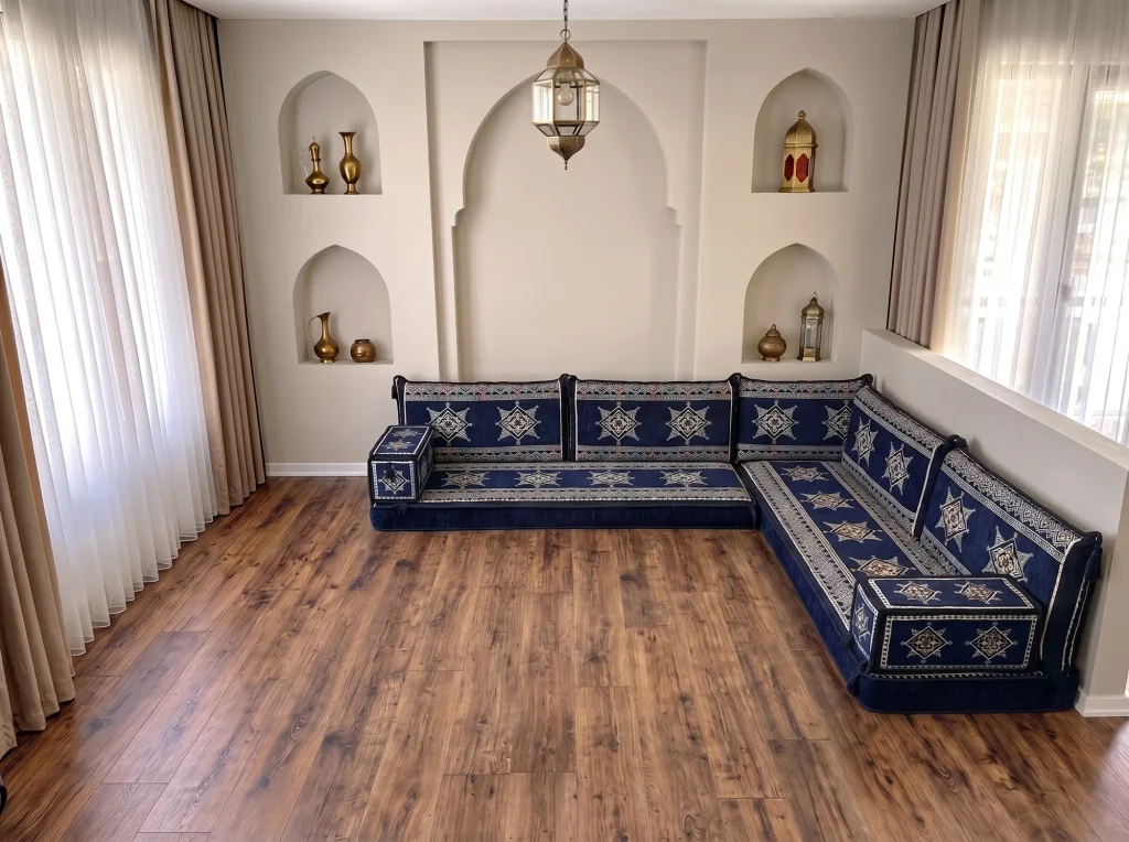 Navy floor sofa set with cream eight-point stars in an L-shaped corner layout on a bare wooden floor