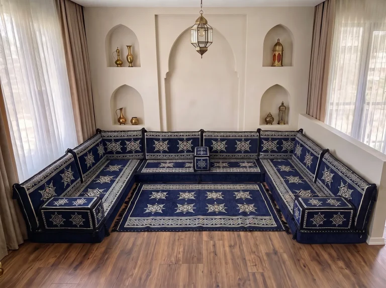Navy star-pattern Arabic floor sofa in a U shape framing a matching navy and cream star rug