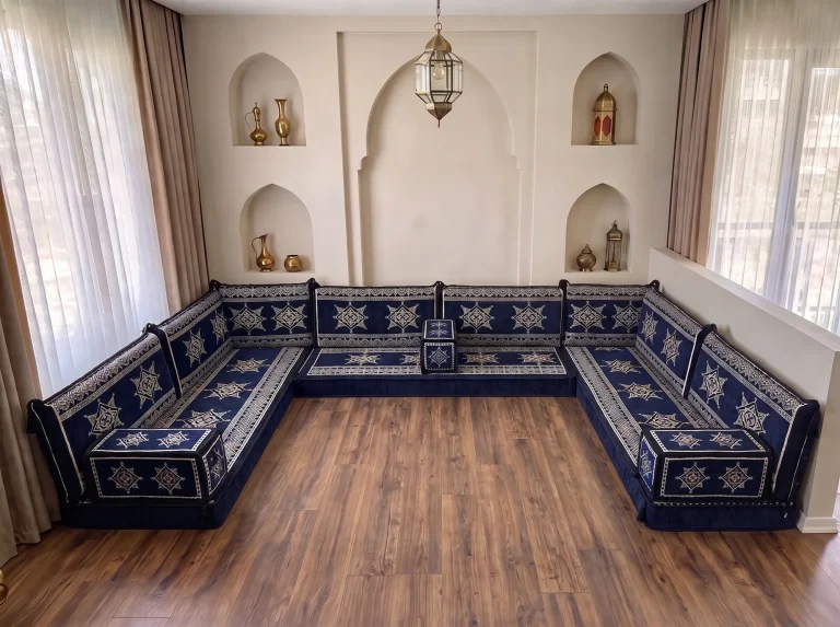 Navy floor seating set with cream star motifs lining three walls in a U shape, floor left bare