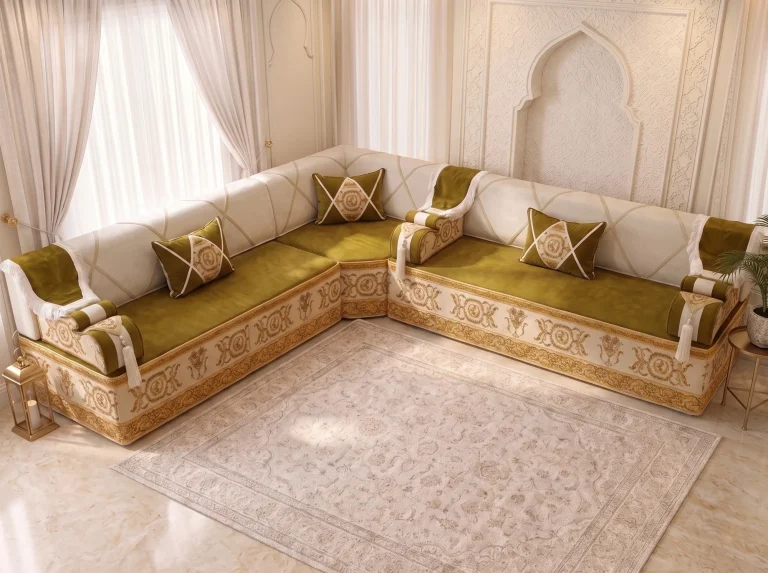 High-angle view of an olive and ivory L-shaped majlis sofa with gold baroque borders and three cushions