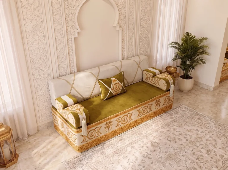 Single olive and ivory majlis seating set with gold baroque base seen from above beside a carved wall