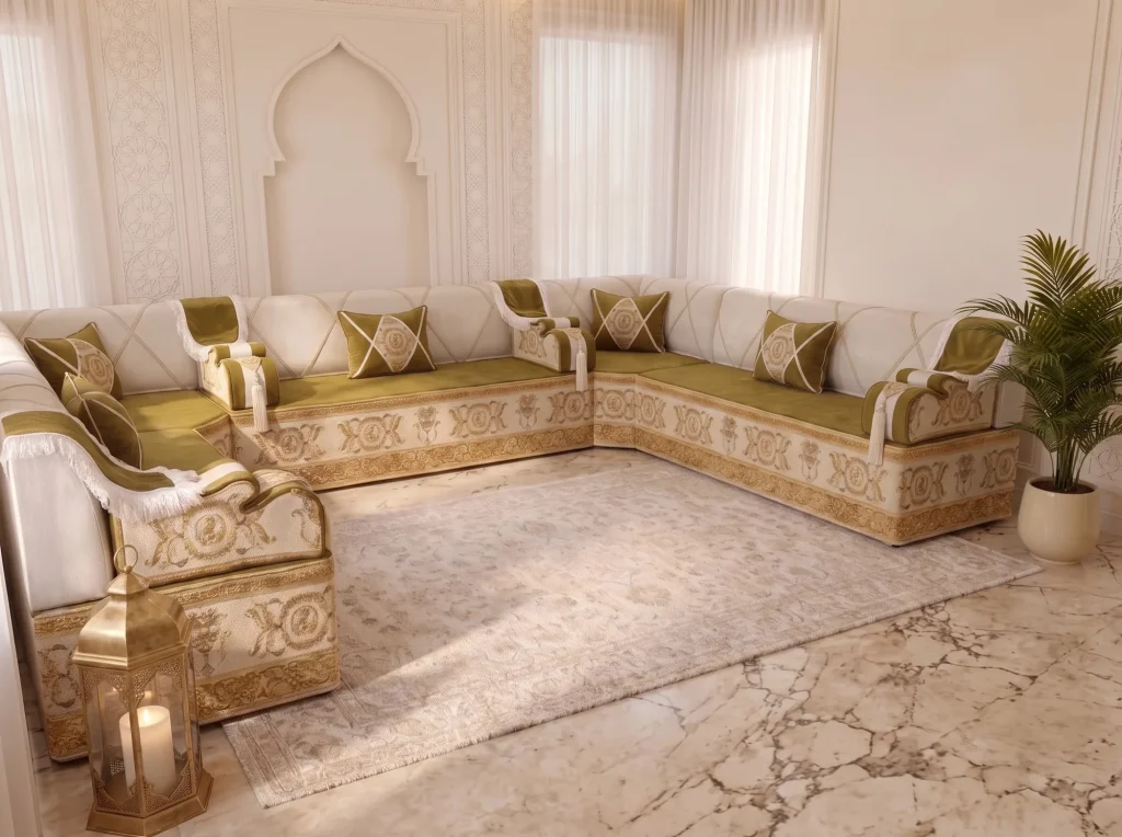 Olive and ivory U-shaped majlis sofa with gold baroque base viewed from the side past a brass lantern