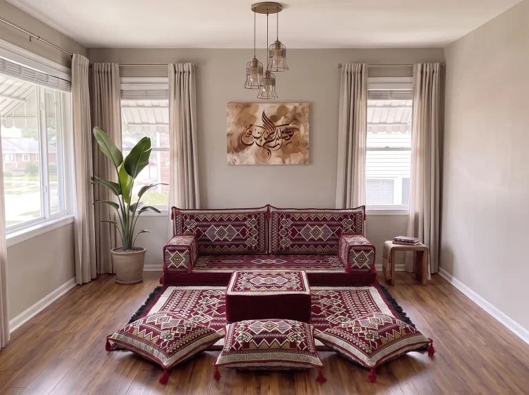 Burgundy and cream kilim single-row Arabic floor couch with rug, ottoman and floor cushions in a grey living room