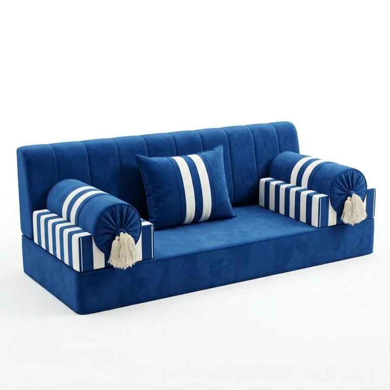 Royal blue velvet majlis sofa unit with white-striped armrests, round tasselled bolsters and a striped cushion, on white