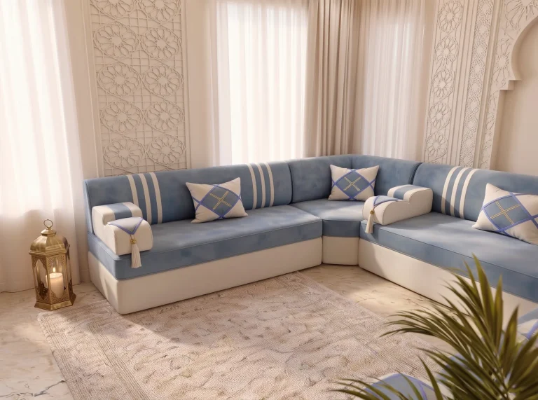 Sky blue and cream majlis sofa set seen across a corner with a brass lantern on the floor and palm in front