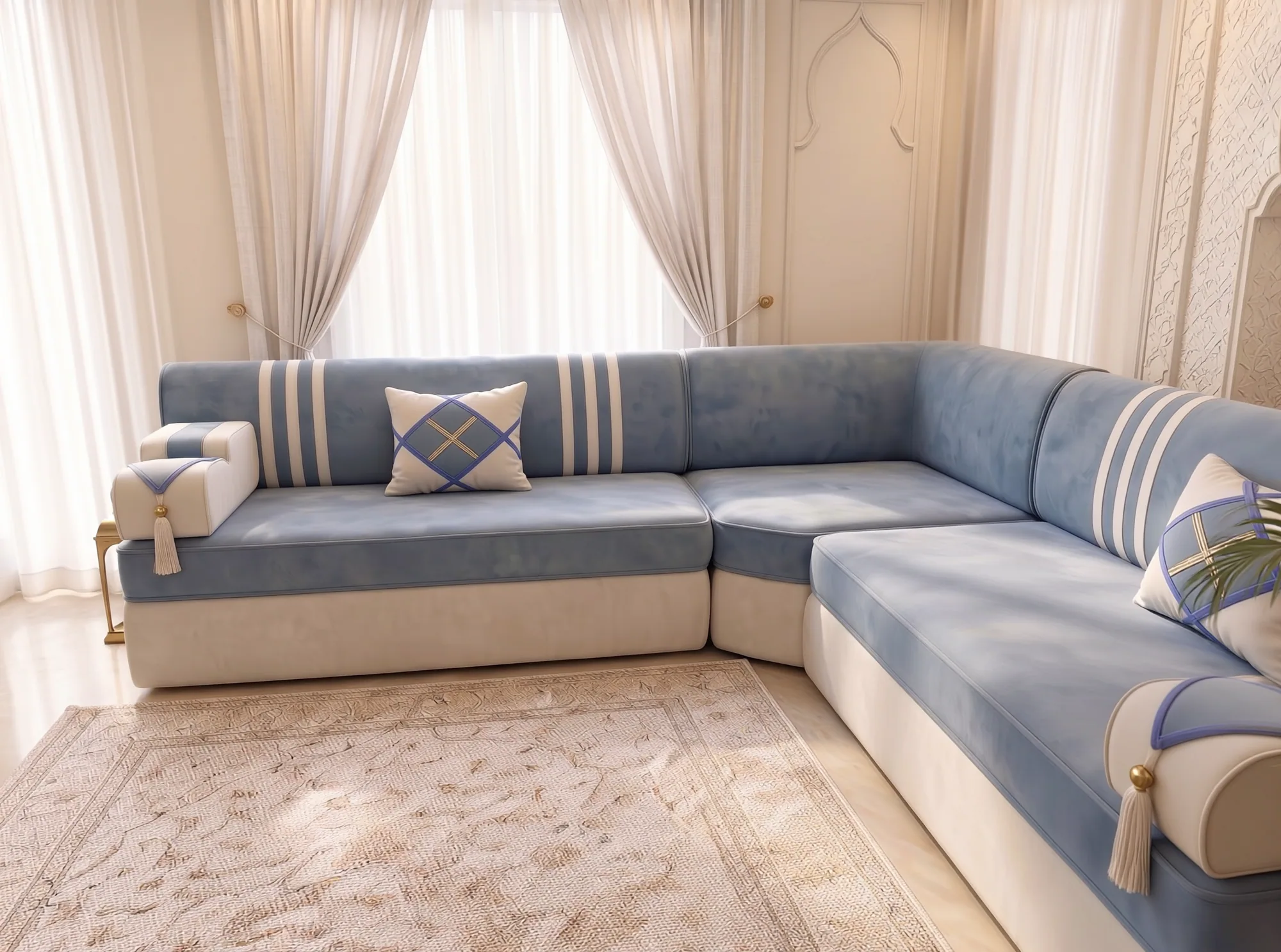 Sky blue majlis sofa in an L shape viewed along its right side, with a cream armrest in the foreground