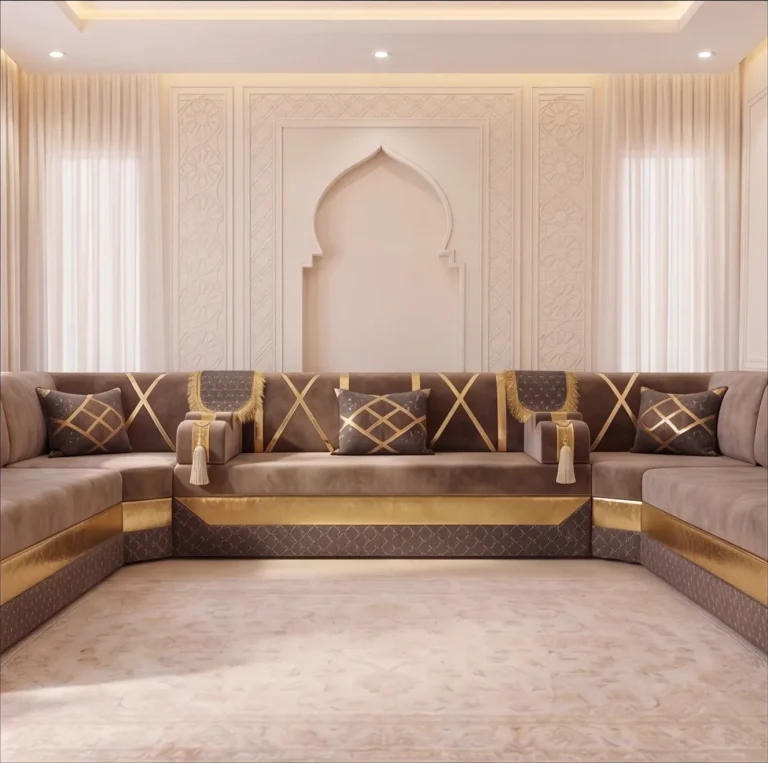 Front-on view of a taupe and gold Arabic majlis with three lattice cushions below a carved arch niche
