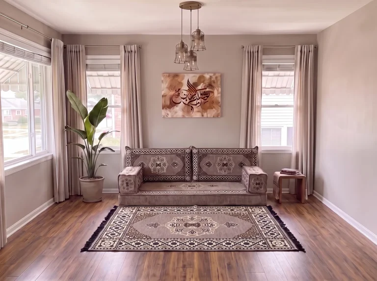 Taupe medallion single-row floor sofa set with a matching fringed rug in a neutral living room, close view