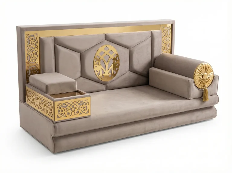 Taupe velvet majlis sofa with a tall hexagon-panelled back, a pierced gold oval ornament and a gold tray armrest