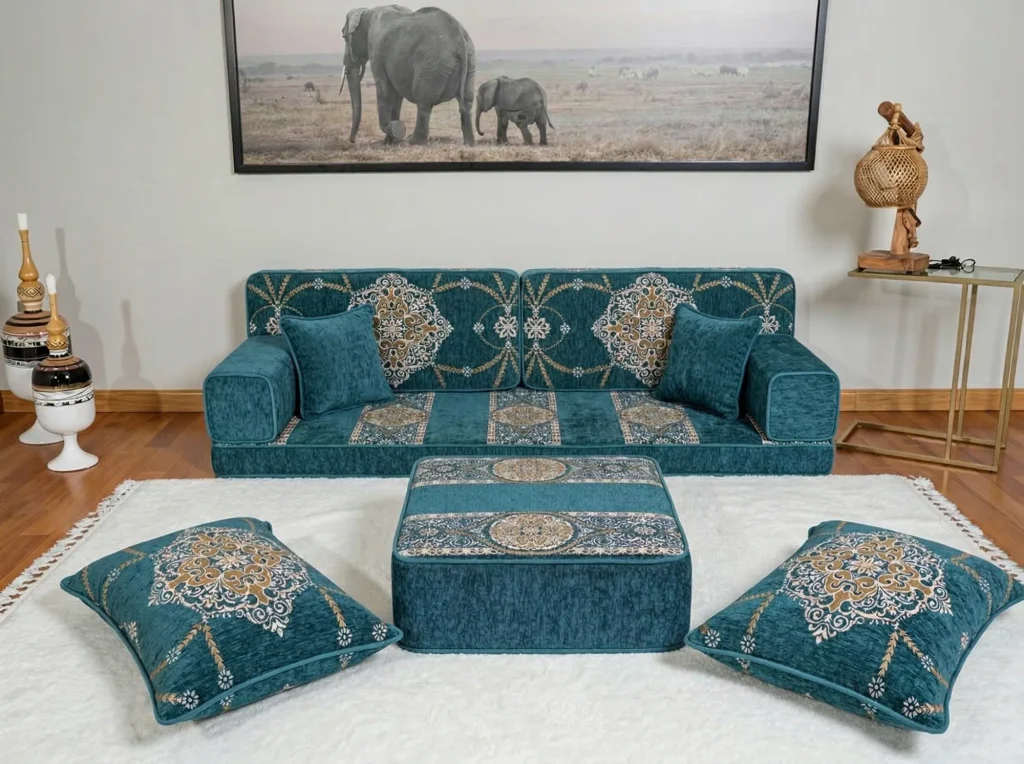 Teal chenille Arabic floor sofa with gold medallion cushions, matching ottoman and two floor cushions