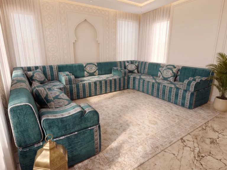 Teal and silver Arabic jalsa photographed diagonally from one end, with striped bases on a marble floor