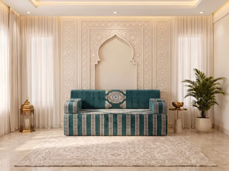 Single teal velvet majlis sofa with an ivory medallion on the backrest and a striped base under an arch