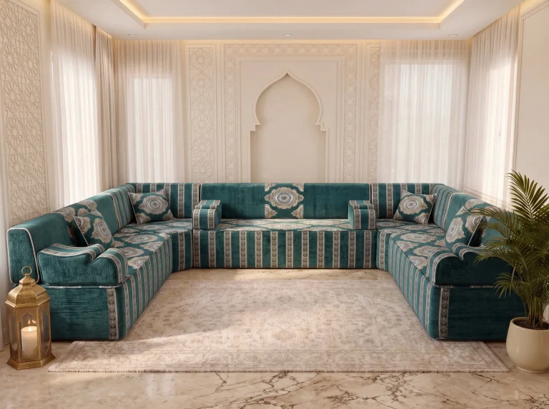 Teal velvet U-shaped Arabic majlis with ivory medallion cushions and striped base around a cream rug